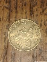 Front side of 1922 French coin showing allegorical figures and inscriptions Commerce Industrie.