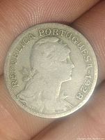 Obverse side of the 1928 Portuguese coin showing profile and inscription