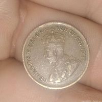 Obverse side of the coin showing King George V portrait and inscription