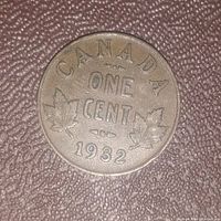 Reverse side of a 1932 Canadian one cent coin showing the denomination, year, and maple leaf design.