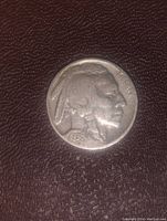 Obverse side of 1936 Buffalo nickel showing Native American profile and date.