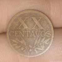 Obverse side of 1945 XX Centavos coin showing denomination and olive sprig decoration.