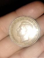 Front side of 1947 Australian Kangaroo Penny showing King George VI profile and inscriptions