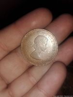 Obverse side of the 1966 penny showing Queen Elizabeth II profile and inscription