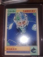 Front image of the hockey card showing player portrait and branding details.