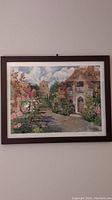 Full view of the framed Elizabeth Berry watercolor print titled 'Berry Countryside', showing a colorful countryside garden and pathway scene.