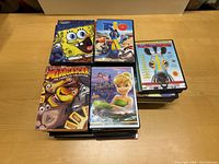 Photo showing top selection of DVDs including SpongeBob SquarePants Season 6, Rio, Madagascar, Tinker Bell