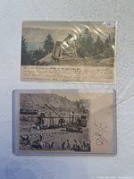 Two mining postcards showing an early mining structure by water and a black and white mining scene with men and equipment