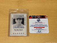 Photo of Pee Wee Reese autographed baseball card encased in Elvira PRO plastic holder with accompanying Global Authentics Certificate of Authenticity with verification sticker.
