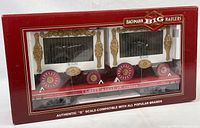 Front view of boxed train car showing cage compartments, wheels, and packaging details.