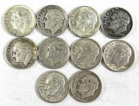 Front view of ten silver Roosevelt dimes showing obverse side with dates and Liberty inscriptions.