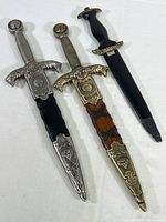 Photo of three King Arthur themed display cutters laid side by side showing overall condition and length.
