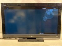 Front view of Sony Bravia TV powered on and displaying no signal screen, showing 40 inch diagonal with Sony brand.