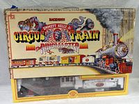 Original box front showing circus-themed artwork and train illustration