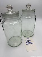 Front view of both glass canisters with lids