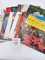 Stack of holiday LPs topped by Percy Faith “Music of Christmas” showing overall lot