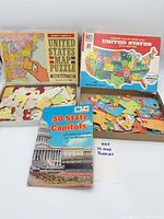 Overview showing both open puzzle boxes and booklet