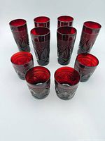 All ten ruby red glasses arranged, showing height difference