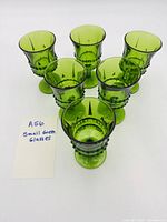 Top view of all six green wine glasses