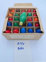 Full box showing assorted colored bulbs in dividers