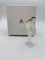 Heron figurine standing beside original white Swarovski Silver Crystal box