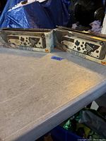 Two boxed die-cast Toronto Maple Leafs tour buses on a table.