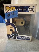 Photo of Funko POP! Coraline with Cat #422 vinyl figure in original box with window panel showing figure inside.