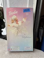 Box front view showing pastel colors with Barbie image and Winter's Reflection text.