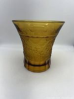 Full view of the vintage amber glass vase showing overall shape and color.