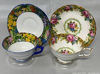 Two sets of vintage Paragon teacups with matching saucers, showing color and pattern contrast