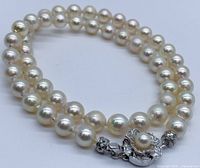 Close-up of pearls and sterling silver floral clasp