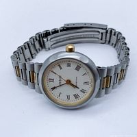 Angled front view of watch on white background showing face, bracelet and crown.