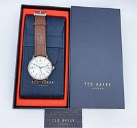 Ted Baker men's leather strap watch in original navy blue box with orange interior and branded card underneath.
