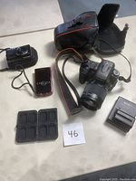 All cameras and accessories laid out on table