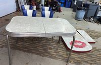 Full lot view including table, chairs, and extension leaves