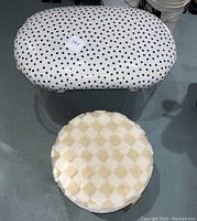 Top view showing the polka dot vinyl covered lucite bench and the small furry stool with beige and white checkered pattern.