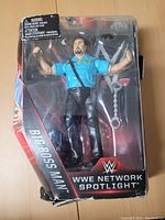 Big Boss Man WWE Network Spotlight action figure in packaging, showing figure with security uniform and accessories.