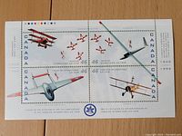 Front of the Canadian International Air Show 1999 stamp sheet showing four stamps with aircraft images.