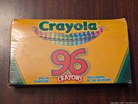 Front of unopened Crayola 96 crayons box showing brand name, number of crayons, and built-in sharpener label.