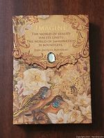 Front view of the notecard set cover showing the Jean-Jacques Rousseau quote with gold embossed floral and bird designs