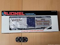 Front view of the Lionel Inside Track model train boxcar in its original packaging, showing product window and branding.