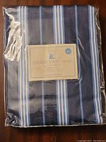 Front view of unopened drapery panel packaging showing product label with brand and measurements.