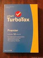 Front view of sealed TurboTax Premier software box highlighting product features and 12 returns support.