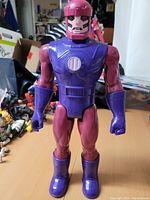 Front-facing view of the large Sentinel figure showing detailed torso and face