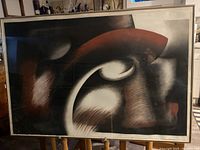 Full view of large framed abstract artwork with Mid-Century Modern styling in a dark wooden frame behind glass.