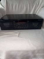 Front view of Denon DRW-580 showing both cassette bays and control panel