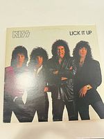 Front cover of KISS Lick It Up LP showing band photo and album title