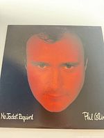 front album cover with Phil Collins portrait