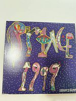 Front cover with stylized Prince 1999 artwork