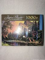 Front of sealed puzzle box showing artwork and 1000-piece count